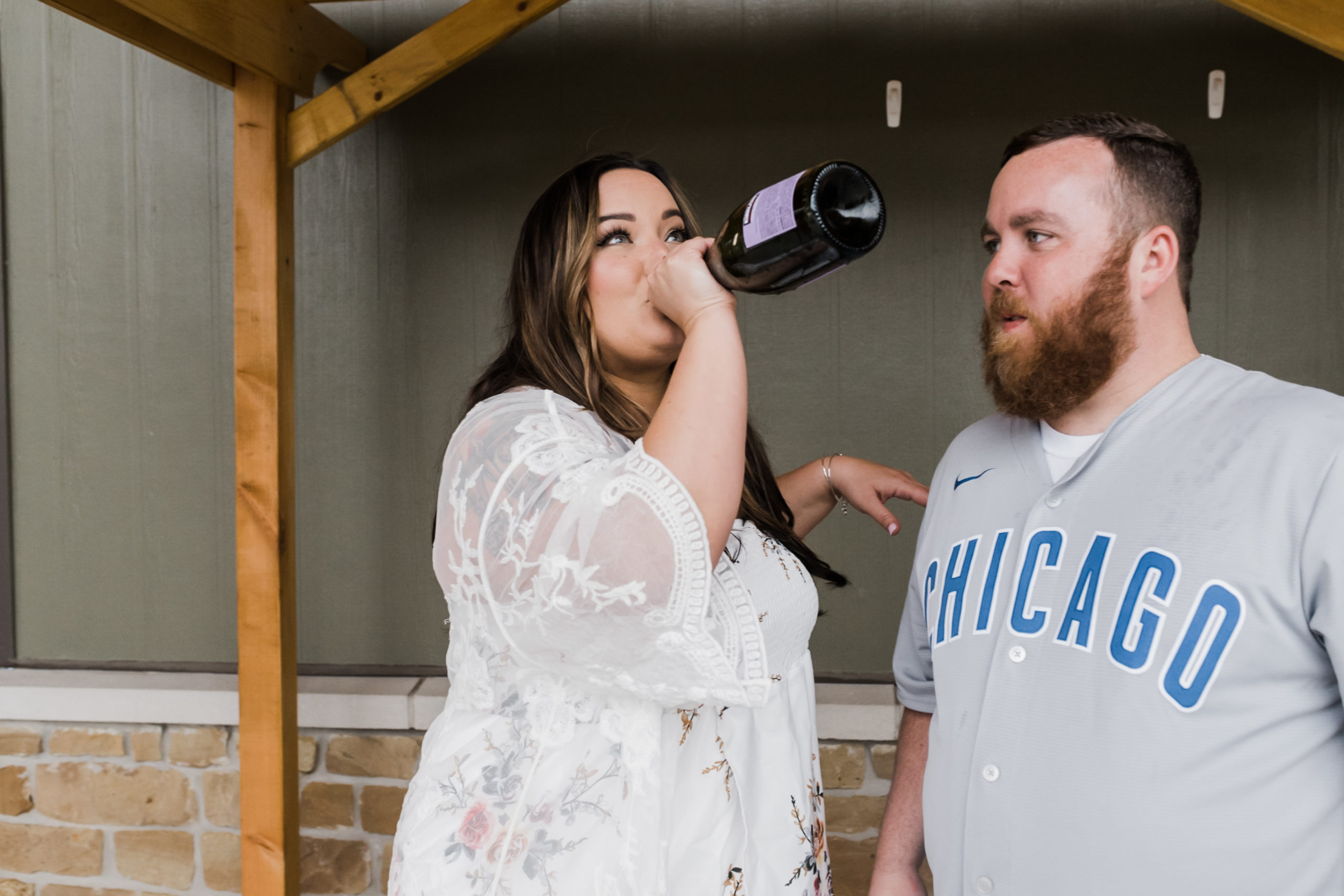 bride drinking champagne at rehearsal dinner