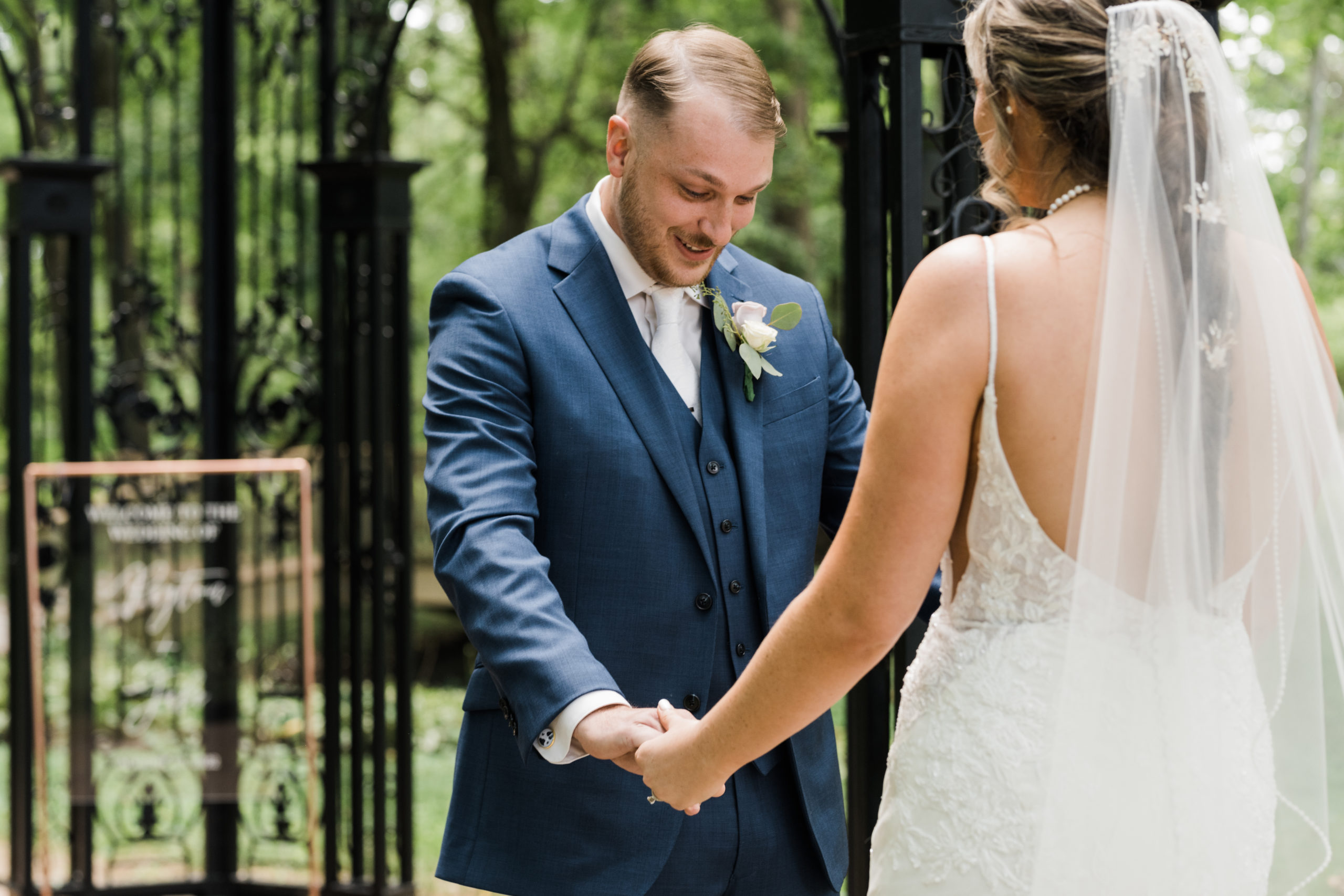 Wedding photographer captures groom's reaction first look Black Iris wedding Carmel, Indiana